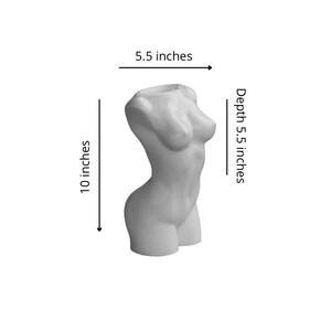 May include: White ceramic planter shaped like a human torso. The planter is 5.5 inches wide, 5.5 inches deep, and 10 inches tall.