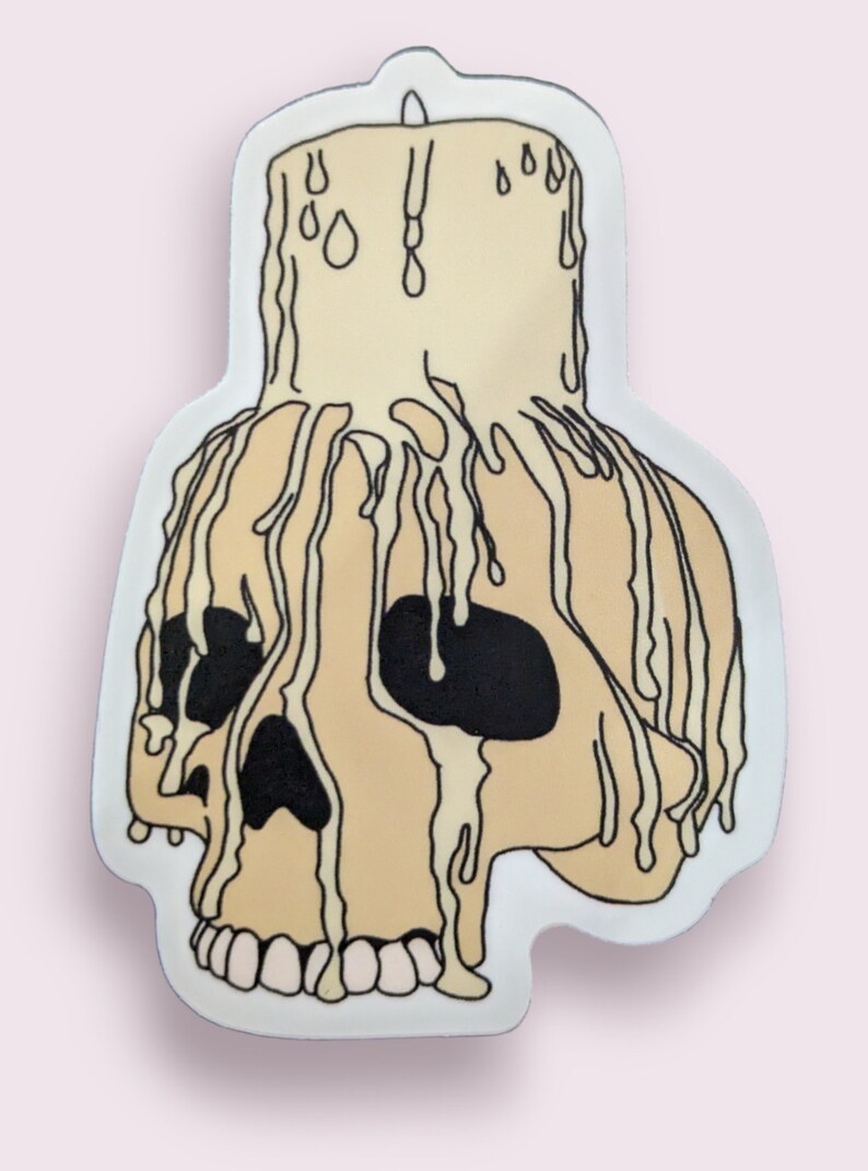 May include: A white skull with dripping wax, resembling a candle. The skull is outlined in black and has black eye sockets.