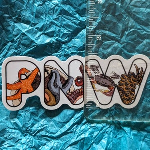 May include: White sticker with the letters PNW in a wavy font. Each letter is decorated with a different sea creature, including an orange starfish, a blue seahorse, a red octopus, a crab, and a brown and yellow seahorse.