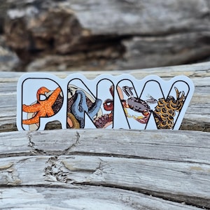 May include: A white sticker with the letters "PNW" in black outlined letters. Each letter is filled with a different illustration of a sea creature. The "P" has a starfish, the "N" has an octopus, the "W" has a crab.