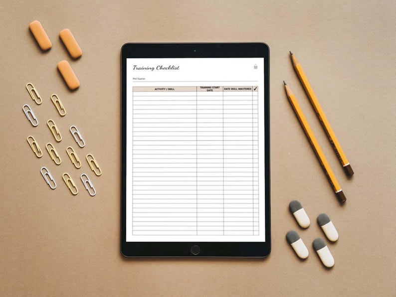 May include: A black tablet with a white screen displaying a training checklist with the title "Training Checklist". The checklist has columns for "Activity / Skill", "Training Start Date", and "Date Skill Mastered".