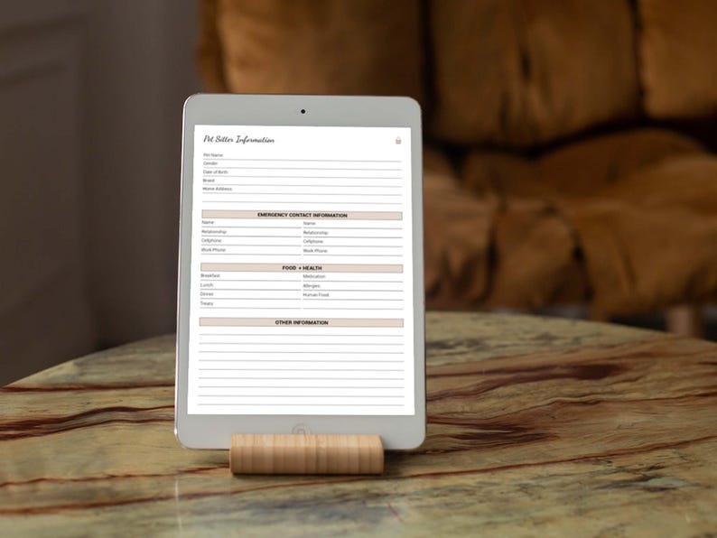 May include: A white tablet with a blank pet sitter information form. The form includes sections for pet name, breed, date of birth, emergency contact information, food and health, and other information.