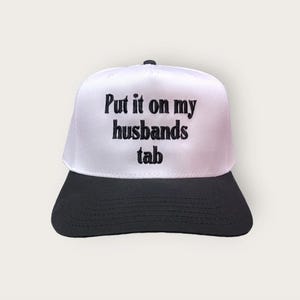 Put it on My Husband's Tab Classic Trucker Hat, Black and White Trucker Hat with embroidered design, Customizable Colors Upon Request