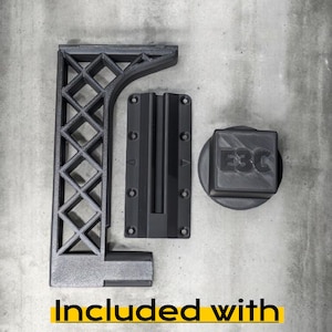 May include: Three black 3D-printed components: an L-shaped bracket with a diamond lattice support structure, a rectangular mounting plate with six screw holes and a central channel, and a square cap featuring the embossed text E3C.