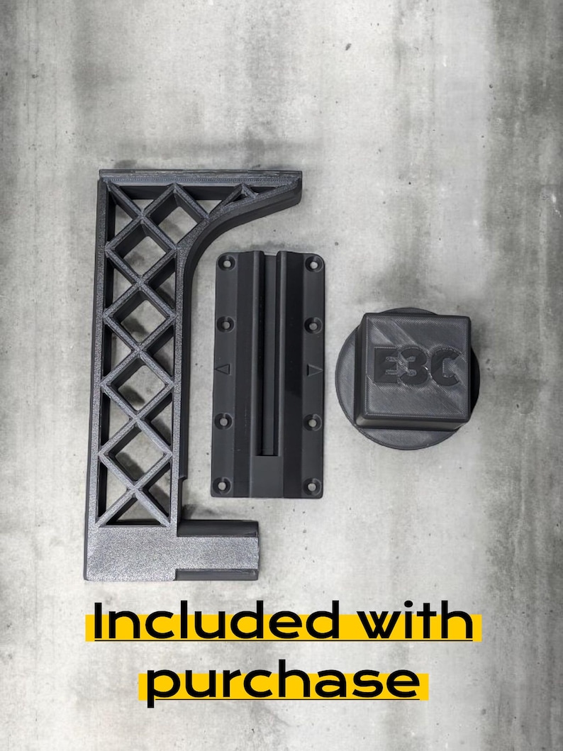 May include: Three black 3D-printed components: an L-shaped bracket with a diamond lattice support structure, a rectangular mounting plate with six screw holes and a central channel, and a square cap featuring the embossed text E3C.