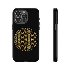 May include: Black phone case featuring a gold geometric flower of life design. The case has a glossy finish and a raised camera bump. The design is centered on the back of the case.
