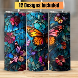 May include: Three stainless steel tumblers with a stained glass design featuring butterflies in shades of pink, orange, and blue. The design is reminiscent of a stained glass window.