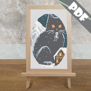 May include: Cross stitch pattern of a black cat with glowing orange eyes holding a small mouse in its paws. The cat is sitting in a snowy landscape with a small house in the background.
