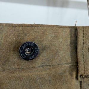 Pantalones de caza dobles Filson, lona de algodón encerado, color verde oliva/marrón claro, para hombre, fabricados en EE. UU., talla 36x31. imagen 9