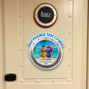 May include: A cream-colored door with a circular room number sign reading "8002". Below, a circular sticker says "We needed this Cruise" with cartoon birds and the text "Sophia" and "Carnival Sunshine 2026".