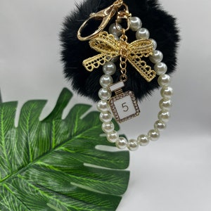 Chanel pom pom keychain outlet
