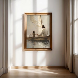 May include: A framed painting shows a figure in white robes with a child in a sailboat. The artwork has a warm colour palette, focusing on the figures and the boat. The painting is displayed on a white wall in a room with wooden flooring.