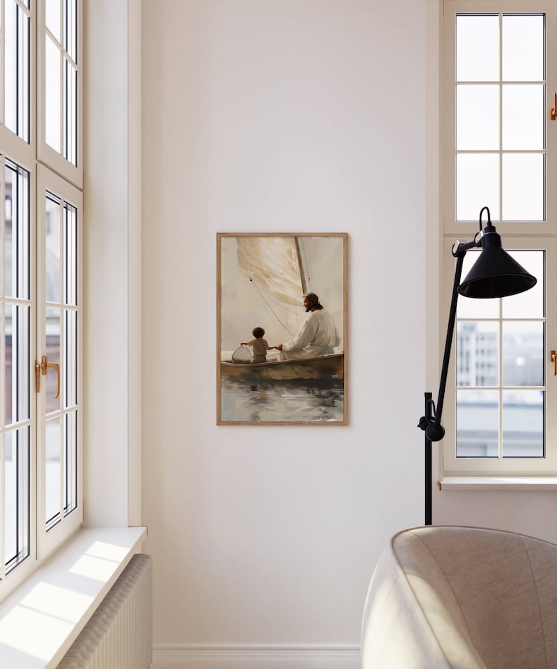 May include: A framed art print showing two figures in a sailboat on water. The artwork uses soft, muted colours and has a vintage aesthetic. The figures are dressed in flowing robes, and the boat has a sail.