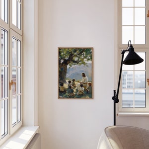 May include: A painting of Jesus teaching a group of children under a tree. The painting is in a wooden frame and is hanging on a white wall.