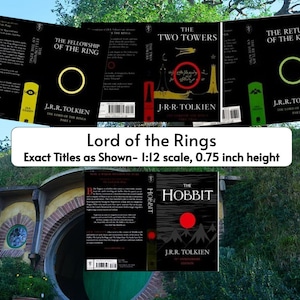 May include: A collection of Lord of the Rings and The Hobbit book covers. The covers are black with white text and feature a red, green, or yellow ring. The covers are displayed in front of a hobbit hole.