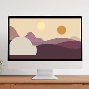May include: A computer monitor displaying a digital illustration of a desert landscape with two suns and a dome-shaped structure in the foreground.