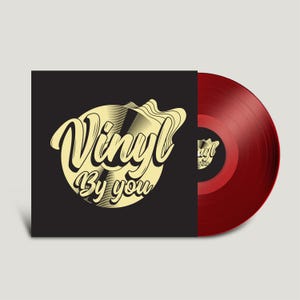 May include: A black vinyl record sleeve with a gold design that says "Vinyl By You". The record is red.