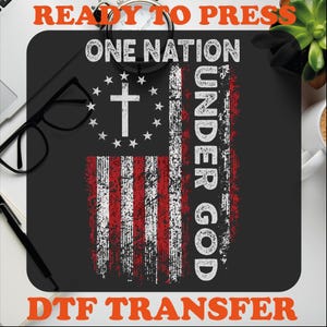 May include: A black and red DTF transfer design with a distressed American flag, a cross, and the text "One Nation Under God".