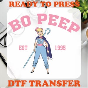 May include: A white iron-on transfer design featuring a cartoon image of Bo Peep from Toy Story. The design includes the text "Bo Peep" in pink letters, "EST 1995" in black letters, and "READY TO PRESS DTF TRANSFER" in orange letters.