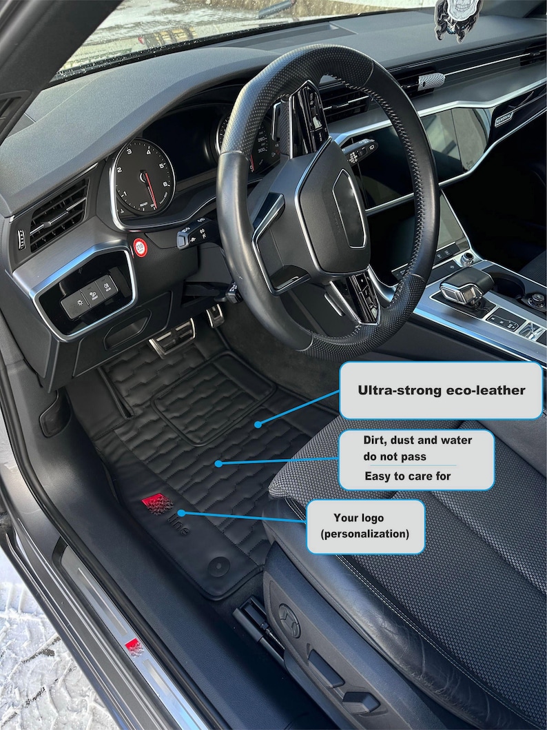 May include: Black car floor mats made of eco-leather with a textured surface. The mats are designed to be water, dirt, and dust resistant. The mats feature a logo that can be personalized.