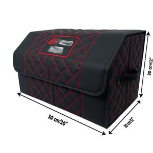 May include: Black car trunk organizer with red stitching. The organizer is 20 inches long and 12 inches high. It features a quilted pattern and a logo on the lid. Includes a handle for easy carrying.