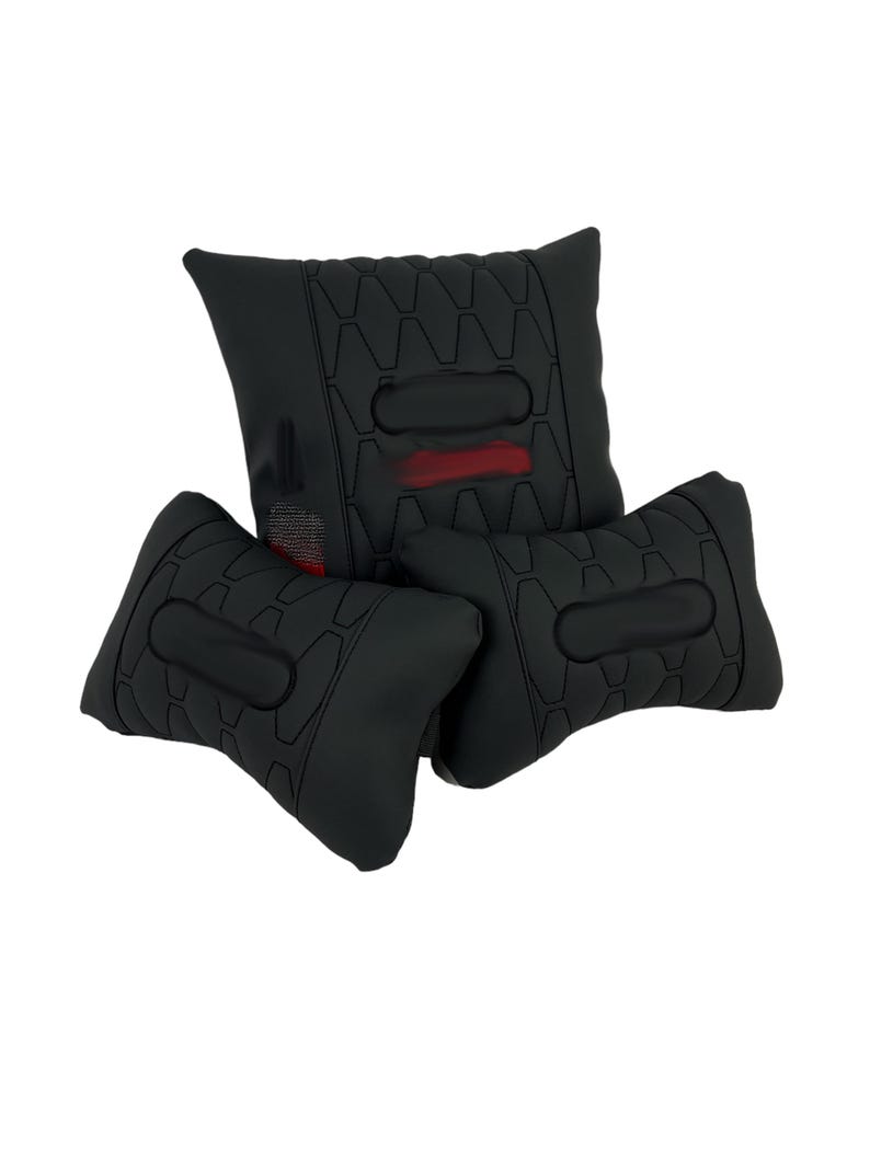 May include: Three black cushions with a geometric pattern and a central oval design. One cushion has a red accent. The cushions are arranged in a stacked configuration, suggesting a seating or support product.