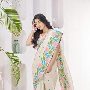 Elegant Floral Linen Silk Saree with Soft Drape, Artistic Border & Lightweight Feel – Includes Unstitched Blouse Piece