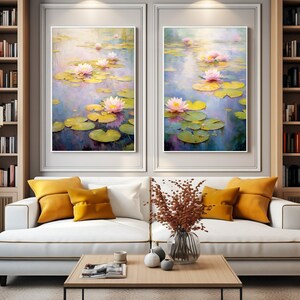 May include: Two framed paintings of pink water lilies on a pond with green lily pads. The paintings are hanging on a wall above a white couch with yellow throw pillows. There is a vase with dried flowers on a wooden coffee table in front of the couch.