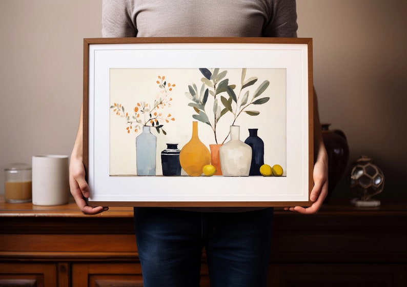 May include: A framed print of a still life featuring a variety of vases and branches with leaves and flowers. The vases are in shades of blue, white, yellow, and orange. The background is a light cream color.