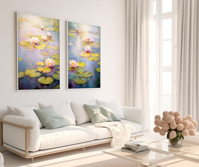 May include: Two framed paintings of water lilies in a pond. The paintings are in a light blue and purple color scheme with green lily pads and pink flowers.