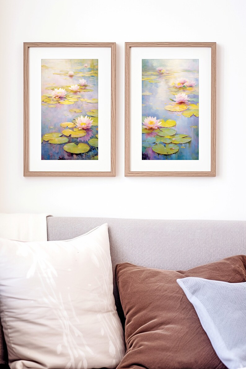 May include: Two framed paintings of water lilies in a pond. The paintings are in a light wood frame and feature pink water lilies with green lily pads and blue water.