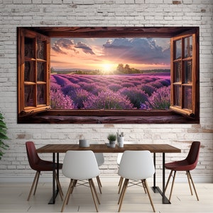 May include: A framed canvas print of a window looking out onto a field of lavender flowers. The sun is setting behind the flowers, creating a warm glow. The window is open, and the frame is made of wood.