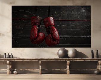 May include: Two red boxing gloves hanging from a rope in a boxing ring. The gloves are worn and have a distressed look. The background is a dark, textured wall.