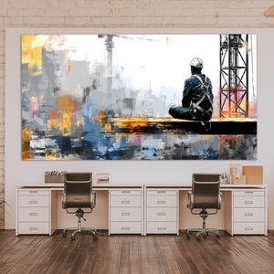 May include: Large abstract canvas art print depicting a construction worker seated on a beam, with a crane and industrial structures in the background. The artwork uses a palette of grey, yellow, blue, and orange.
