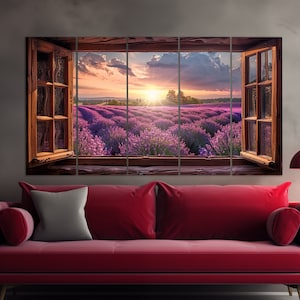 May include: A multi-panel canvas print depicting a view of a lavender field through an open window. The field is bathed in the golden light of a setting sun, with a bright blue sky above. The window frame is made of wood and has a rustic, weathered look.