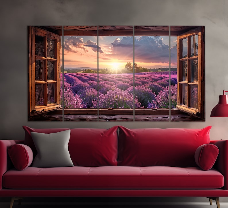 May include: A multi-panel canvas print depicting a view of a lavender field through an open window. The field is bathed in the golden light of a setting sun, with a bright blue sky above. The window frame is made of wood and has a rustic, weathered look.