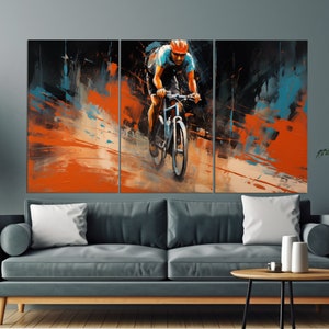 May include: A painting of a cyclist riding a mountain bike on a dirt path. The cyclist is wearing a helmet and a bright orange jersey. The background is a blur of orange, blue, and black.