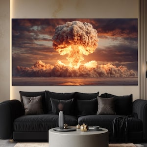 May include: A large canvas print depicting a nuclear explosion. The image shows a mushroom cloud with a bright orange and yellow core, surrounded by dark, ominous clouds. The scene is set over a body of water.