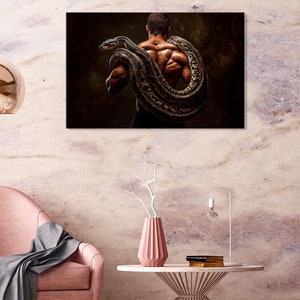 May include: A muscular man with a large snake wrapped around his torso. The snake is brown and black with a textured pattern. The man is facing away from the camera and has a dark background.