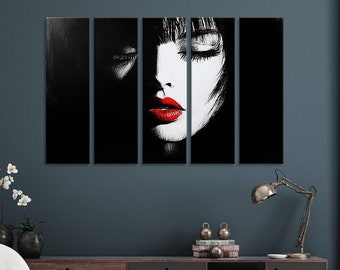 May include: A black and white canvas print of a woman's face with closed eyes and red lips. The print is divided into five panels.