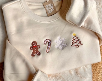 Extra tjock krämfärgad sweatshirt med broderad unisex juldesign: pepparkaka, polkagris, snöflinga, julgran. Ekologisk bomull och återvunnen polyester, 350 g/m².