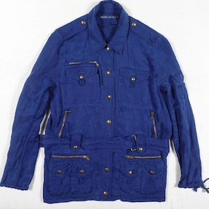 May include: A blue denim jacket with a belt, multiple pockets, and a zipper closure. The jacket has a  "Ralph Lauren" label on the left side of the collar.
