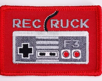 Parche de moral de Rec Ruck para videojuegos de Nintendo NES (bordado con velcro de 2 x 3 pulgadas)