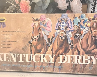 May include: A vintage Kentucky Derby board game box featuring an illustration of four jockeys riding horses in a race. The box includes text listing game components like a pari-mutuel system, scratch sheet, tote board, and eight race program.