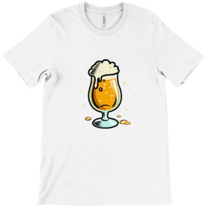 May include: A white t-shirt featuring a cartoon illustration of a glass of beer with a foamy head.