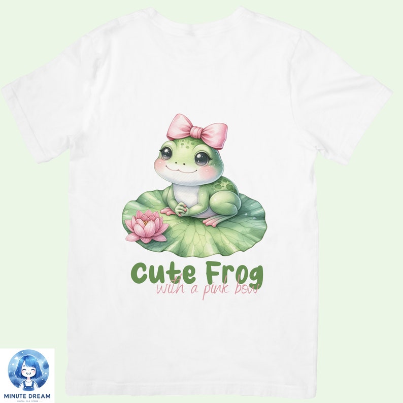 May include: White t-shirt with a green frog wearing a pink bow sitting on a green lily pad with a pink flower. The text "Cute Frog with a pink bow" is printed below the frog.