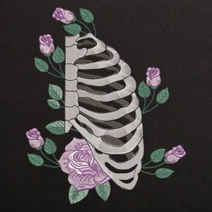 May include: A white ribcage with a gray outline is surrounded by purple roses with green leaves and stems. The background is black.