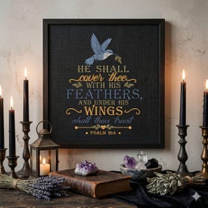May include: A square black framed wall art piece featuring an embroidered blue hummingbird and the gold and blue text: HE SHALL cover thee WITH HIS FEATHERS, AND UNDER HIS WINGS shalt thou trust PSALM 91:4, set against a dark textured background.