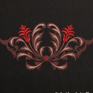 May include: An ornate embroidery design in shades of brown, red, and tan, set against a black background. The design features symmetrical floral and leaf patterns. Text at the bottom reads "Embroidery design file Instant download".