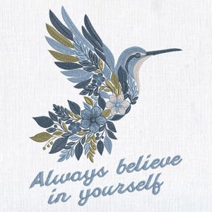 May include: Embroidered design of a hummingbird with floral details in shades of blue, green, and beige. The text "Always believe in yourself" is below the bird in a script font. The design is on a white background.